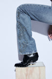Calça Jeans Tachas